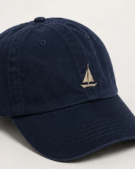Navy washed-cotton cap with embroidered sailboat